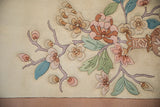 Expressive Art Deco floral motif with shallow carved contour, soft pastel flowers.