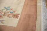 Carved Art Deco floral motif in sky blue, blush, jade, with copper border and fringe.