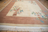 Fringe and shallow carved contour detail on the edge of a vintage Art Deco rug.