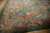 Vintage Indian rug: geometric border in dusty blue, terracotta, and blush pink.