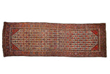 Vintage Hamadan runner with a field of geometric plants and blossoms on an ivory background.
