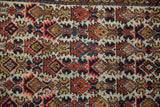 Hand-knotted wool pile of a vintage Hamadan showing varied texture and floral motifs.