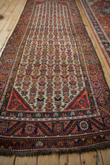 Full length perspective of a vintage Persian Hamadan runner highlighting its repeating geometric design.