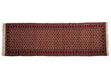 A fine vintage Ardebil runner with an allover floral lattice design in cherry red, ivory, and dark blue.