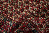Plush, full wool pile texture on a fine vintage Ardebil rug with a cherry red floral lattice.