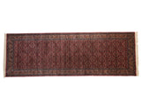 Fine Indian Bijar runner featuring dark cochineal red allover Herati mahi-mahi and navy borders, 4'1