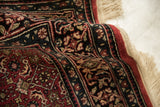 Indian Bijar design rug runner detail: dark red border, fine floral motifs, and intact fringe.
