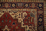The classic Samovar turtle border in navy blue on an Indian Heriz design rug runner.