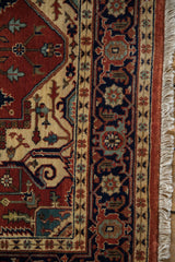 Close-up of the Indian rug's navy blue Samovar turtle border and full, even pile.