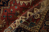 Plush, hand-knotted pile highlighting the stylized Samovar turtle border on a Heriz design rug.