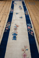 Art Deco runner: cobalt blue border, pink and sky blue florals, smooth ivory pile.