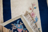 Intact ivory fringe on Vintage Art Deco rug, pink floral motif and cobalt blue.
