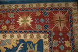 Corner of Indian Bijar rug featuring red, blue, and floral arabesque border patterns.