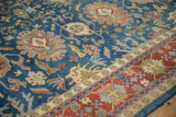 Sky blue field with elaborate floral arabesques and brick red Indian Bijar border.