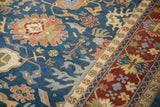 Indian Bijar carpet: elaborate floral arabesques on sky blue field with brick red border.