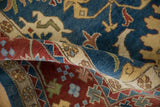 Rolled vintage Indian Bijar carpet showing dense, hand-knotted pile in sky blue and brick red.