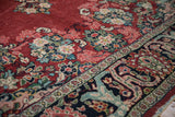 Close view of the vintage Arak's floral arabesque border in sapphire blue, ruby red, and jade.