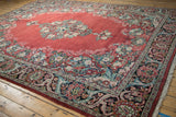 Floral arabesque border and short original fringe on the corner of a vintage Persian Arak carpet.