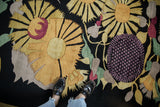 Plush vintage Indian Art Deco carpet with gold sunflowers and purple blossom underfoot.
