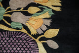 Textured Art Deco floral pattern with gold, mauve, and green blossoms on a dark navy field.