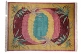 Indian Arts and Crafts carpet, carved scrolling medallion, saffron, pink, burgundy, ocean green.