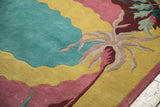 Contoured carving on vintage Indian carpet, showing teal, saffron, and burgundy stylized vines.