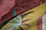 Contoured carving and saffron, burgundy, ocean green colors on the Indian Arts and Crafts rug.