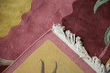 Contoured pile carving in saffron yellow and cochineal red with white fringe detail.