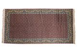 Vintage Bulgarian Tabriz rug runner with a rust allover Herati pattern and detailed buttercream and blue borders.
