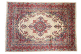 Vintage Persian Kazvin carpet with ivory field, quatrefoil medallion, red and blue florals.