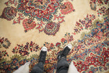 Traditional vintage Kazvin rug with ivory field, stemmed bouquets, and floral sprays.