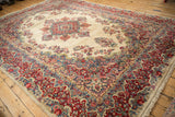 Vintage Persian Kazvin rug with a curvilinear floral border in cherry red and sky blue.