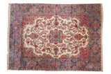 Vintage Kerman carpet, intricate millefleur floral medallion, ivory ground, vibrant gem-tones, 8'9