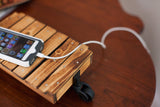 Miniature industrial cart: torched wood planks, metal rivets, and antique black caster.