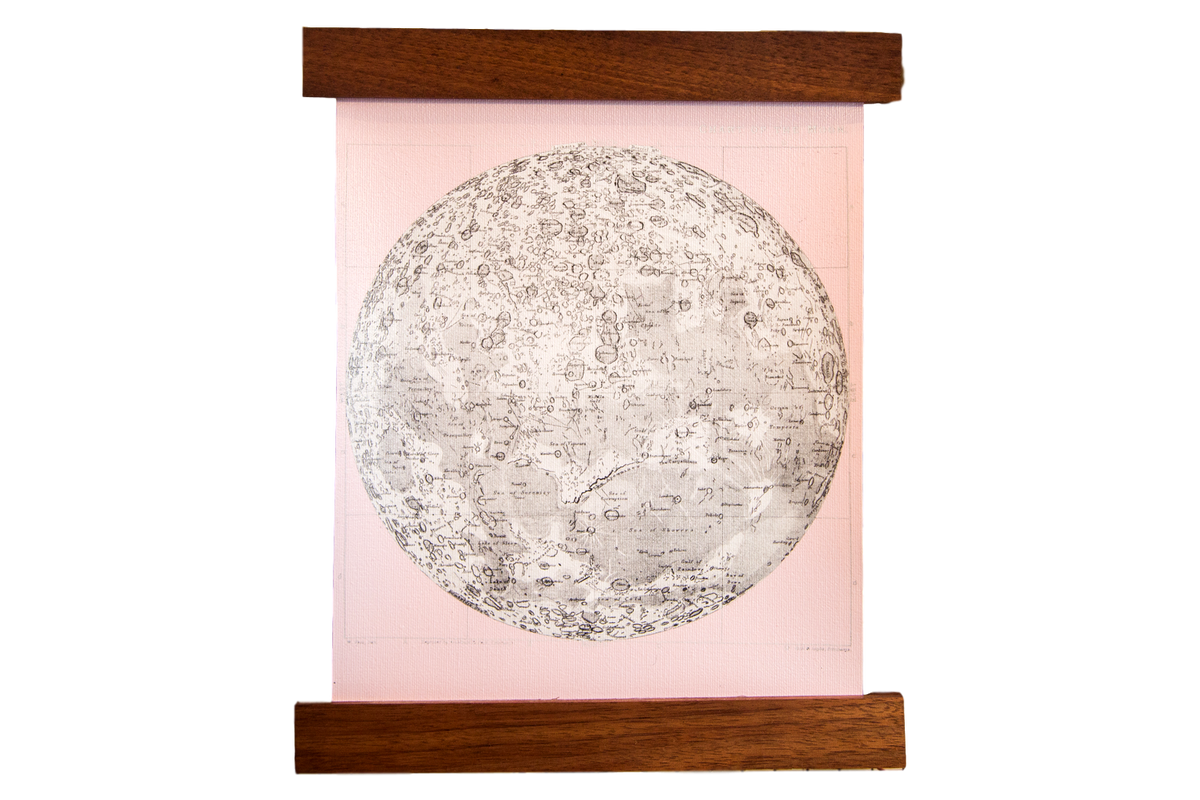 Mini Moon Chart art print on ballerina pink canvas with walnut wood hanging rods.