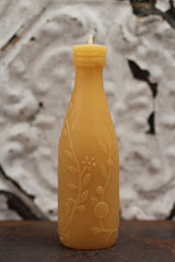 Antique Bottle Beeswax Candle with embossed golden floral vines, leaves, citrus blossoms, and limes.
