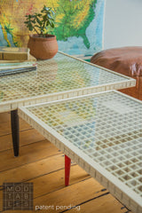 Handmade wooden Mod Sled tables showing a comparison of leg color options.