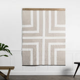 Louise Gray handmade quilt with a geometric white and tan labyrinth pattern, 54x72 inches.