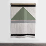Louise Gray No. 8 quilt, with vertical quilting and geometric sage, rose, pewter, tan, black design.