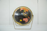 Vintage Mid Century Cram's black globe, 12-inch with colorful continents on brass stand.