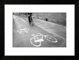 Framed black and white photograph of a biker on a Florence street.