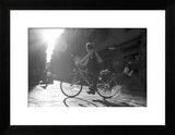 Framed black and white photograph of a biker in a sunlit Florence street, 18x22 print.