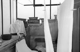 Black and white photograph of an everyday Florence interior with clothes drying.