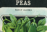 Detail of vintage 'PEAS EARLY ALASKA' seed packet art with stippled blue background.