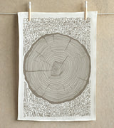 Hand-screenprinted woodland tea towel featuring a grey tree stump graphic and poem text.