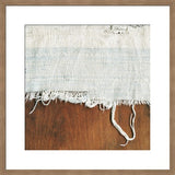 Framed original photograph showing frayed textile with indigo accents on wood.