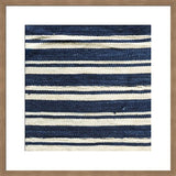 Framed photograph displaying macro detail of indigo and off-white woven textile stripes.
