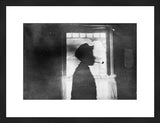Framed black and white antique experimental photograph of a boy with a pipe.