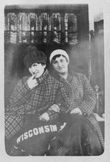 Black and white detail of two smiling Wisconsin women in plaid coats, circa 1910s.