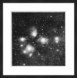 Black and white revival print of Pleiades nebulae, framed with white mat.
